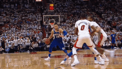 A Group Of Basketball Players Are Playing A Game Of Basketball . GIF