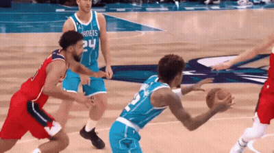 A Group Of Basketball Players Are Playing A Game Of Basketball . GIF
