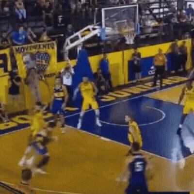 A Group Of Basketball Players Are Playing A Game On A Basketball Court . GIF