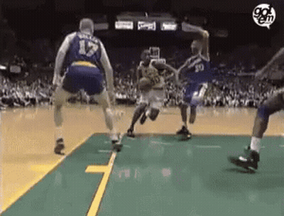 A Group Of Basketball Players Are Playing A Game On A Court . One Of The Players Has The Number 17 On His Jersey . GIF