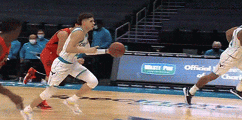 A Group Of Basketball Players Are Playing A Game On A Court Sponsored By Waste Plus GIF