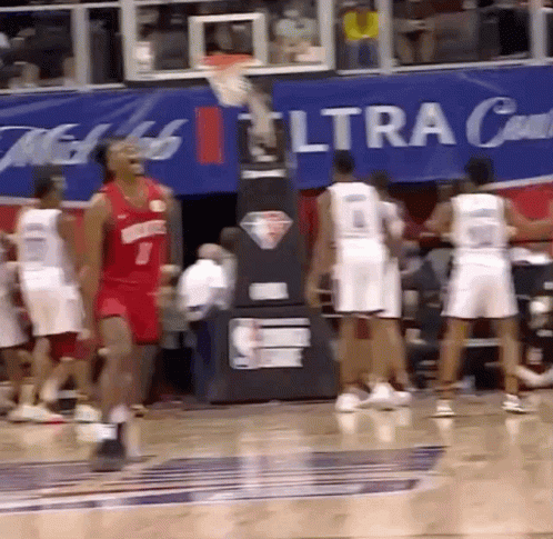 A Group Of Basketball Players Are Playing In Front Of A Banner That Says Ultra GIF