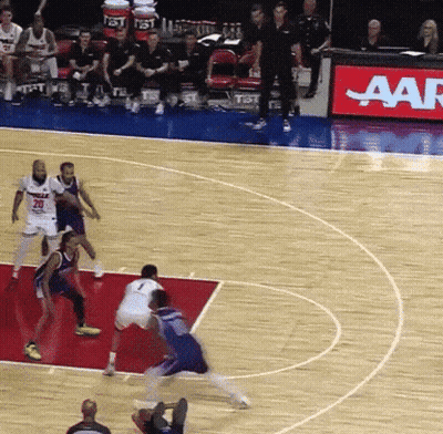 A Group Of Basketball Players Are Playing On A Court With A Aar Sign In The Background GIF
