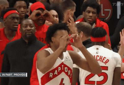 A Group Of Basketball Players Are Standing In A Stadium And One Of Them Is Wearing A Number 5 Jersey GIF