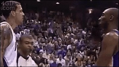 A Group Of Basketball Players Are Standing Next To Each Other On A Court . GIF