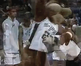 A Group Of Basketball Players Are Standing Next To Each Other On The Court . GIF