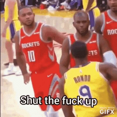 A Group Of Basketball Players Are Standing On A Court And One Of Them Is Talking To Another Player . GIF
