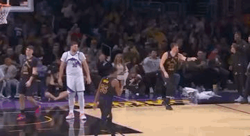 A Group Of Basketball Players Standing On Top Of A Basketball Court . GIF