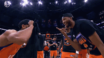 A Group Of Basketball Players Wearing Shirts That Say Phoenix GIF