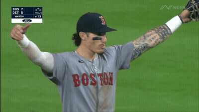 A Group Of Boston Baseball Players Are Hugging Each Other GIF