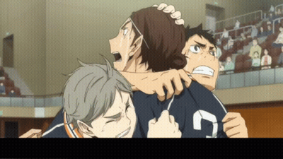 A Group Of Boys Are Hugging Each Other And One Of Them Has The Number 7 On His Shirt GIF