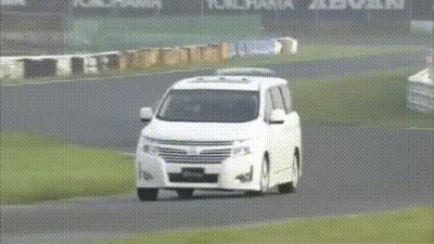 A Group Of Cars Are Driving On A Track With Yokohama Advan Written On The Wall GIF