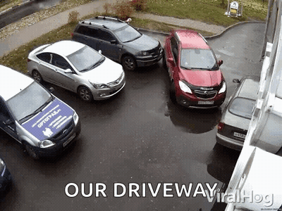 A Group Of Cars Are Parked In A Driveway With The Caption " Our Driveway Viral Hog " GIF
