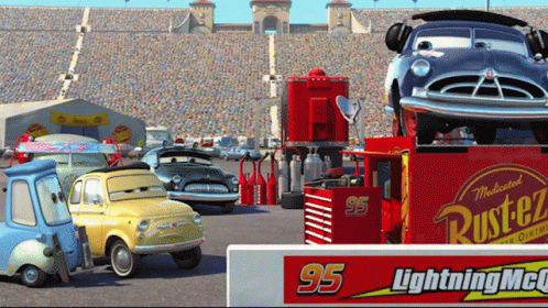 A Group Of Cars Are Parked In Front Of A Sign That Says Lightning Mcqueen GIF
