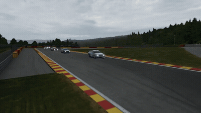 A Group Of Cars Are Racing Down A Track GIF