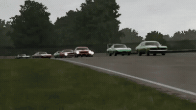 A Group Of Cars Are Racing On A Track And One Of Them Has The Word Ford On It GIF