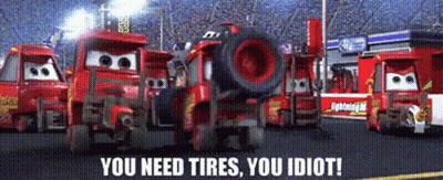 A Group Of Cars Are Standing In A Parking Lot With The Words " You Need Tires You Idiot " On The Bottom GIF
