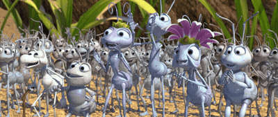 A Group Of Cartoon Ants Are Standing In The Dirt And One Has A Flower On Her Head GIF