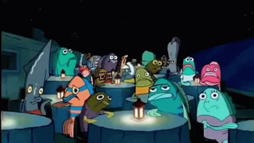A Group Of Cartoon Characters Are Sitting Around A Table With Lanterns . GIF