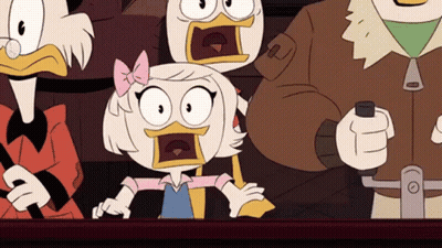 A Group Of Cartoon Characters Are Sitting Around A Table With Their Mouths Open And Their Faces Surprised . GIF