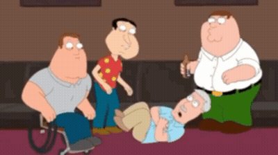 A Group Of Cartoon Characters Are Standing Around A Man Laying On The Floor GIF