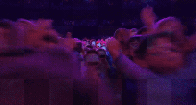 A Group Of Cartoon Characters Are Standing In A Room With Purple Lights . GIF