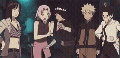 A Group Of Cartoon Characters Are Standing Next To Each Other In A Dark Room . GIF