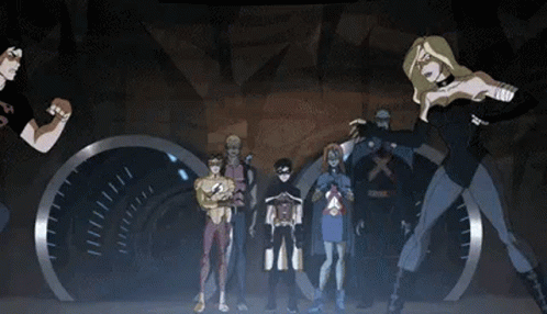 A Group Of Cartoon Characters Standing Next To Each Other In A Dark Room . GIF