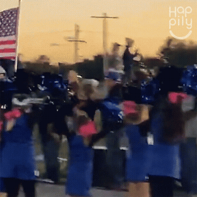 A Group Of Cheerleaders Are Dancing In Front Of An American Flag And A Sign That Says " Hop Pillu " GIF