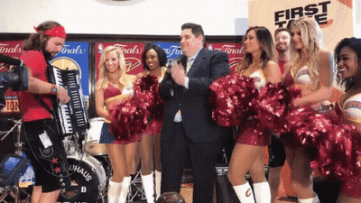 A Group Of Cheerleaders Are Standing In Front Of A Drum That Says Bauhaus GIF