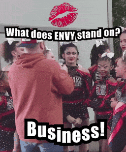 A Group Of Cheerleaders Are Standing In Front Of A Sign That Says Envy Stand On Business GIF