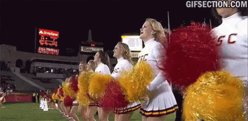 A Group Of Cheerleaders Wearing Uniforms That Say Ucsd GIF