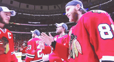 A Group Of Chicago Blackhawks Players Standing Together GIF
