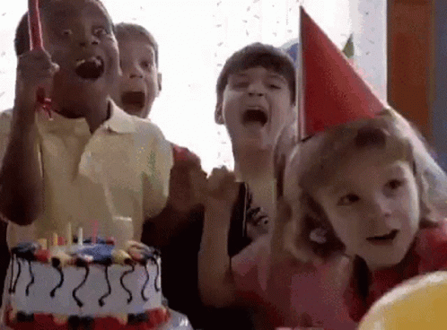 A Group Of Children Are Celebrating A Birthday With A Birthday Cake . GIF