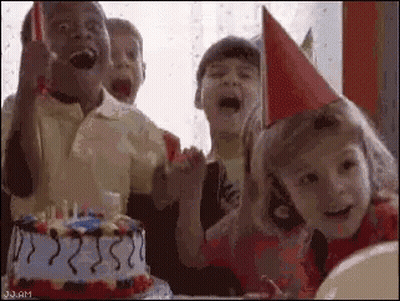 A Group Of Children Are Celebrating A Birthday With A Birthday Cake . GIF