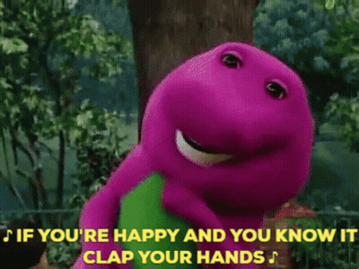 A Group Of Children Are Clapping Their Hands In Front Of A Purple And Green Dinosaur GIF