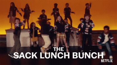 A Group Of Children Are Dancing On A Stage With The Words " The Sack Lunch Bunch " Written Above Them GIF