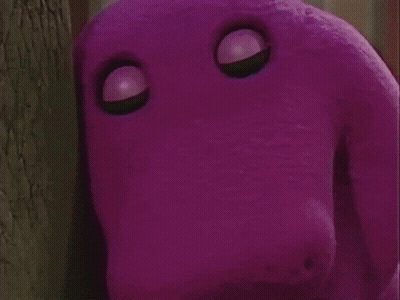 A Group Of Children Are Standing Around A Purple Stuffed Animal . GIF