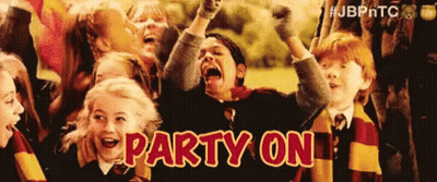A Group Of Children Are Standing In A Field With Their Arms In The Air . GIF