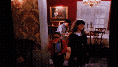 A Group Of Children Are Standing In A Room GIF
