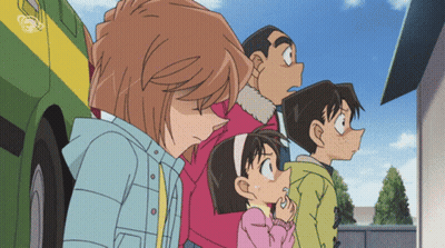 A Group Of Children Are Standing In Front Of A Green And Yellow Vehicle GIF