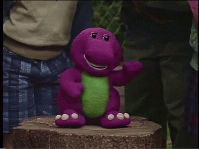 A Group Of Children Are Standing In Front Of A Large Purple Object With A Compass On It GIF