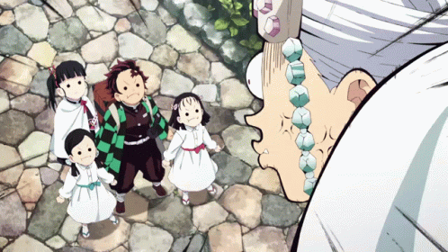 A Group Of Children Are Standing Next To Each Other On A Stone Path GIF