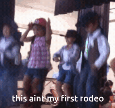 A Group Of Children Dressed In Cowboy Costumes Are Dancing With The Caption This Aint My First Rodeo GIF