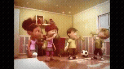 A Group Of Children Playing With A Soccer Ball In A Room GIF