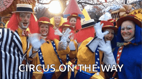 A Group Of Clowns Are Posing For A Picture With The Words Circus On The Way Above Them GIF