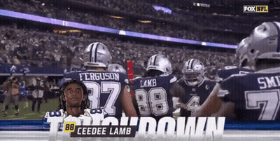A Group Of Cowboys Players Celebrate A Touchdown GIF