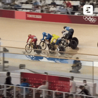 A Group Of Cyclists Are Racing On A Track With Tokyo 2020 Written On The Wall Behind Them GIF