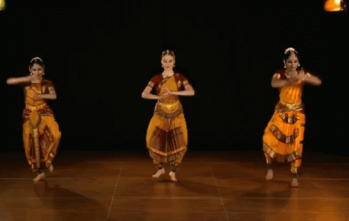 A Group Of Dancers Are Jumping In The Air GIF