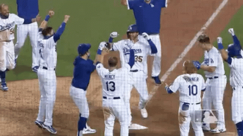 A Group Of Dodgers Baseball Players Are Celebrating GIF